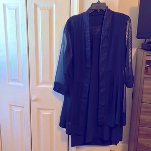 Knee length formal dress. Navy blue with sparkle accent on neck/jacket.Size 16.